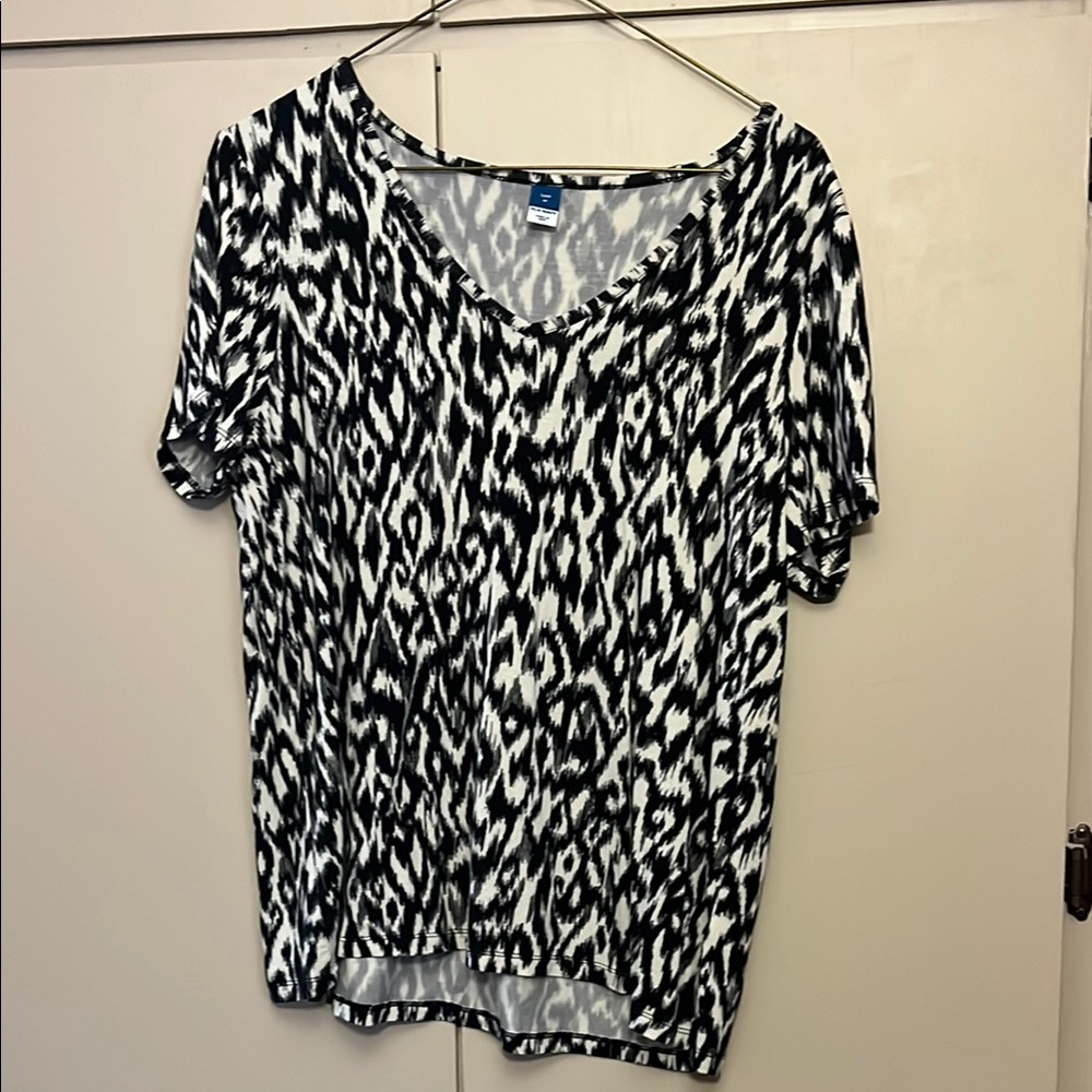 Black and cream colored top
